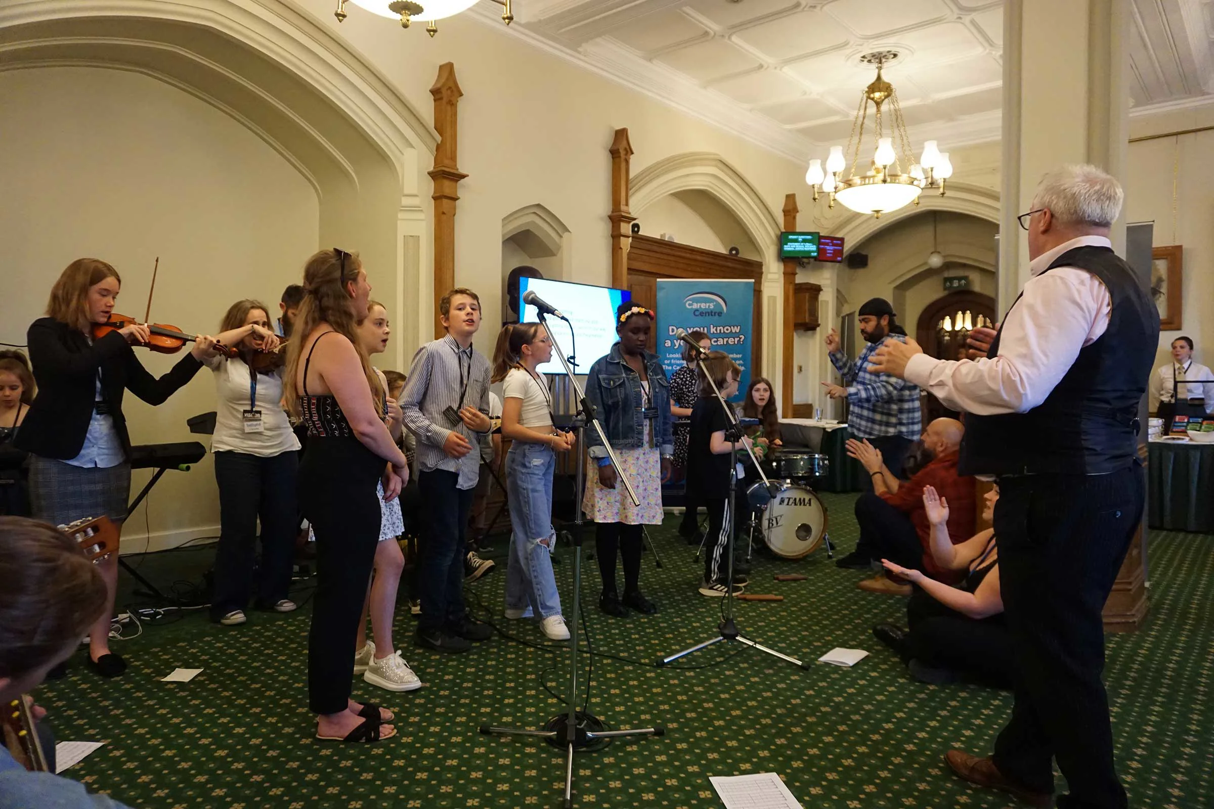 Young carers performing at the House of Commons