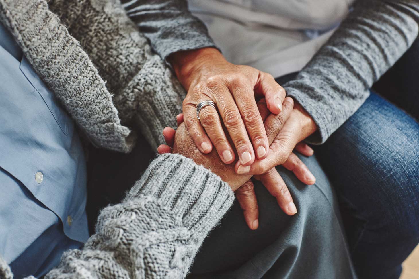 Close up on hands on top of each other