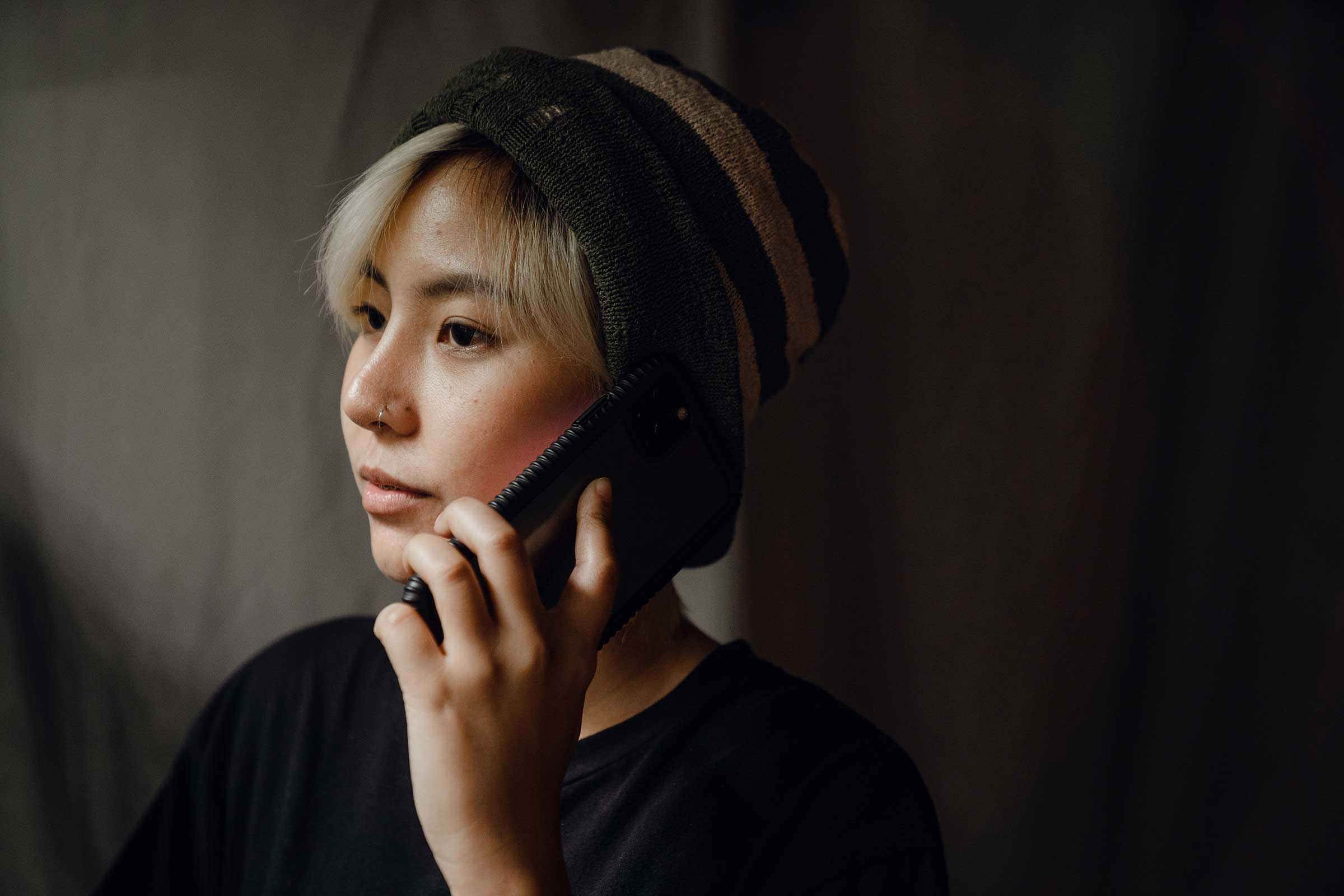 Woman on the phone looking off camera
