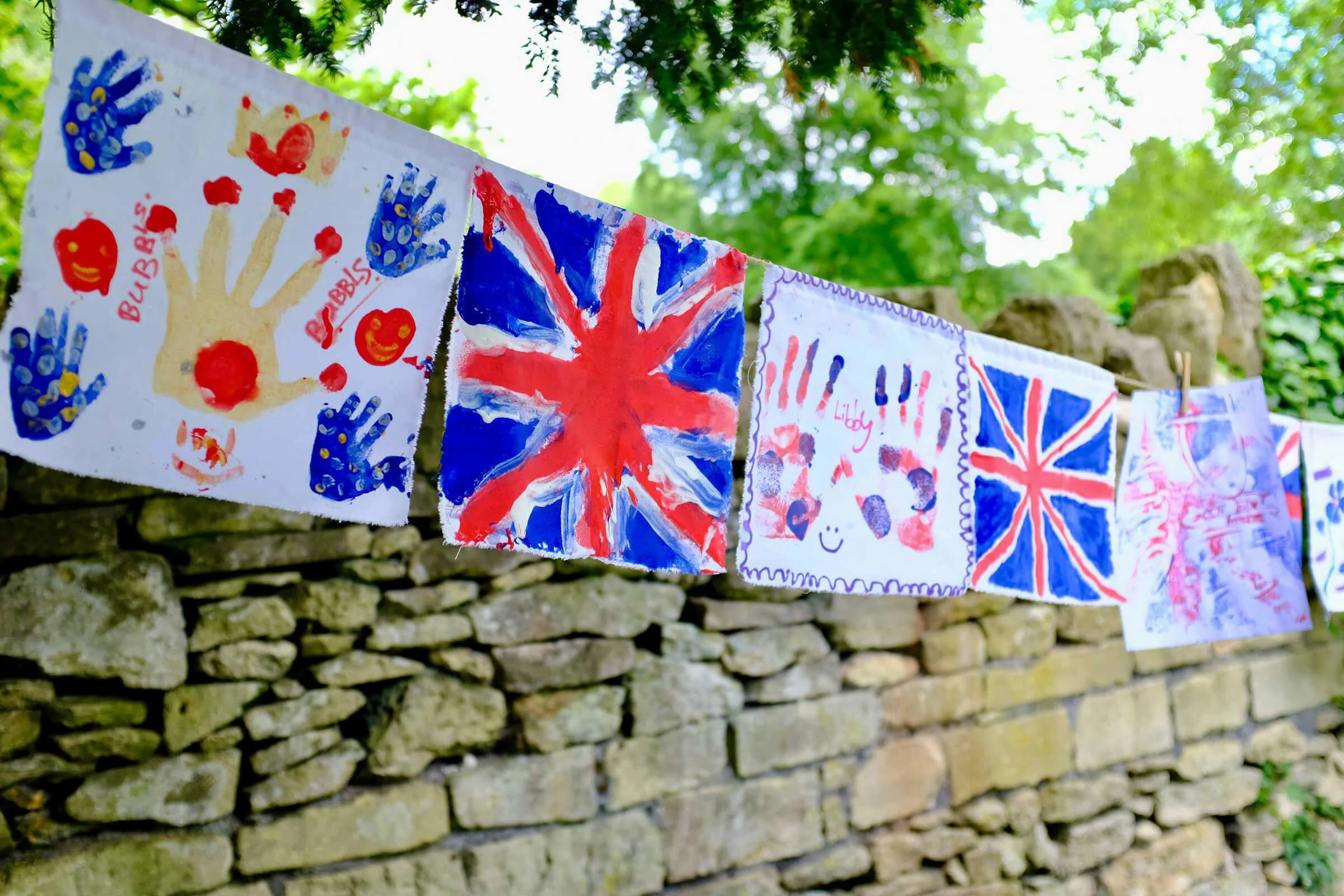 Paintings hung on a string for the Jubilee