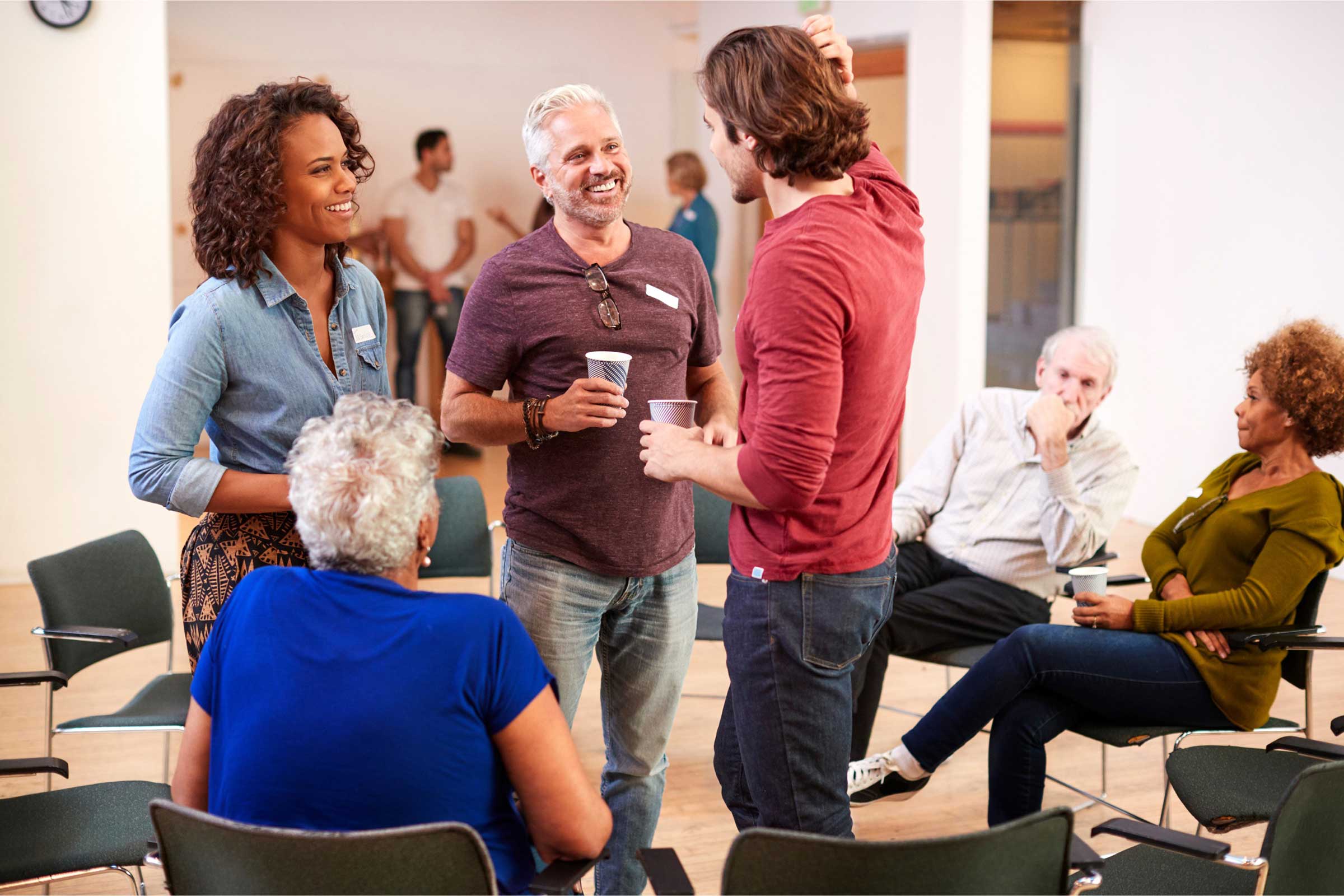 People sitting and standing around chatting