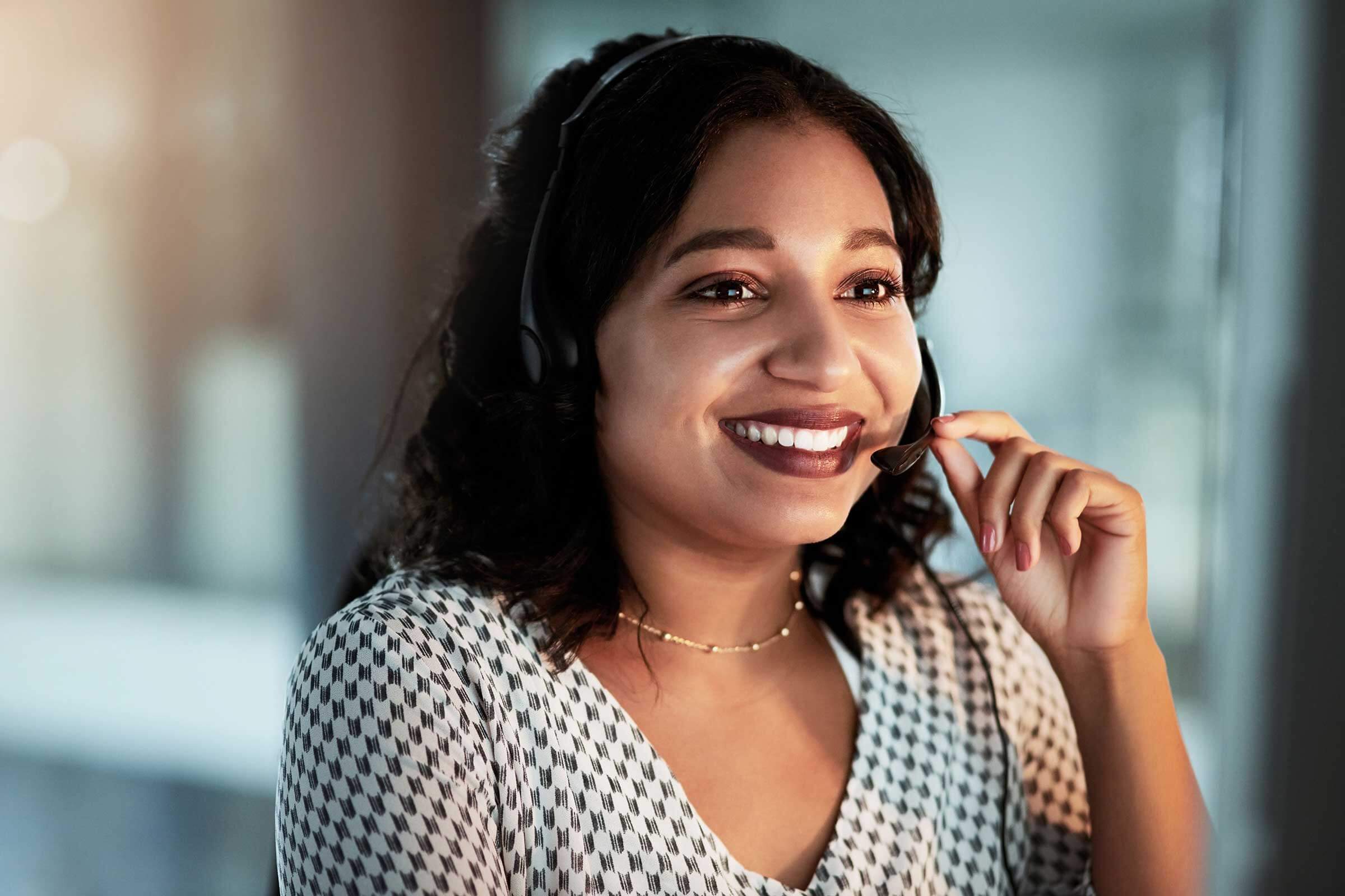 Women with headset on smiling