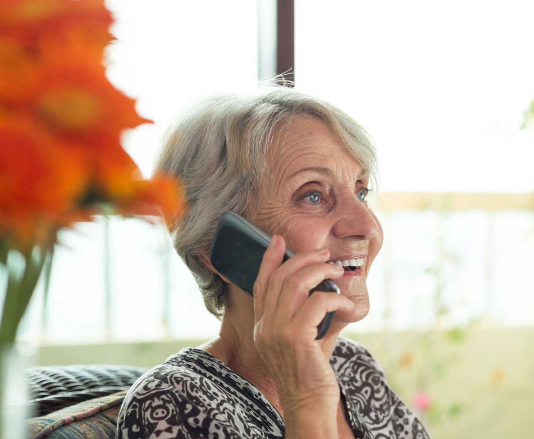 Woman sat down on a mobile phone