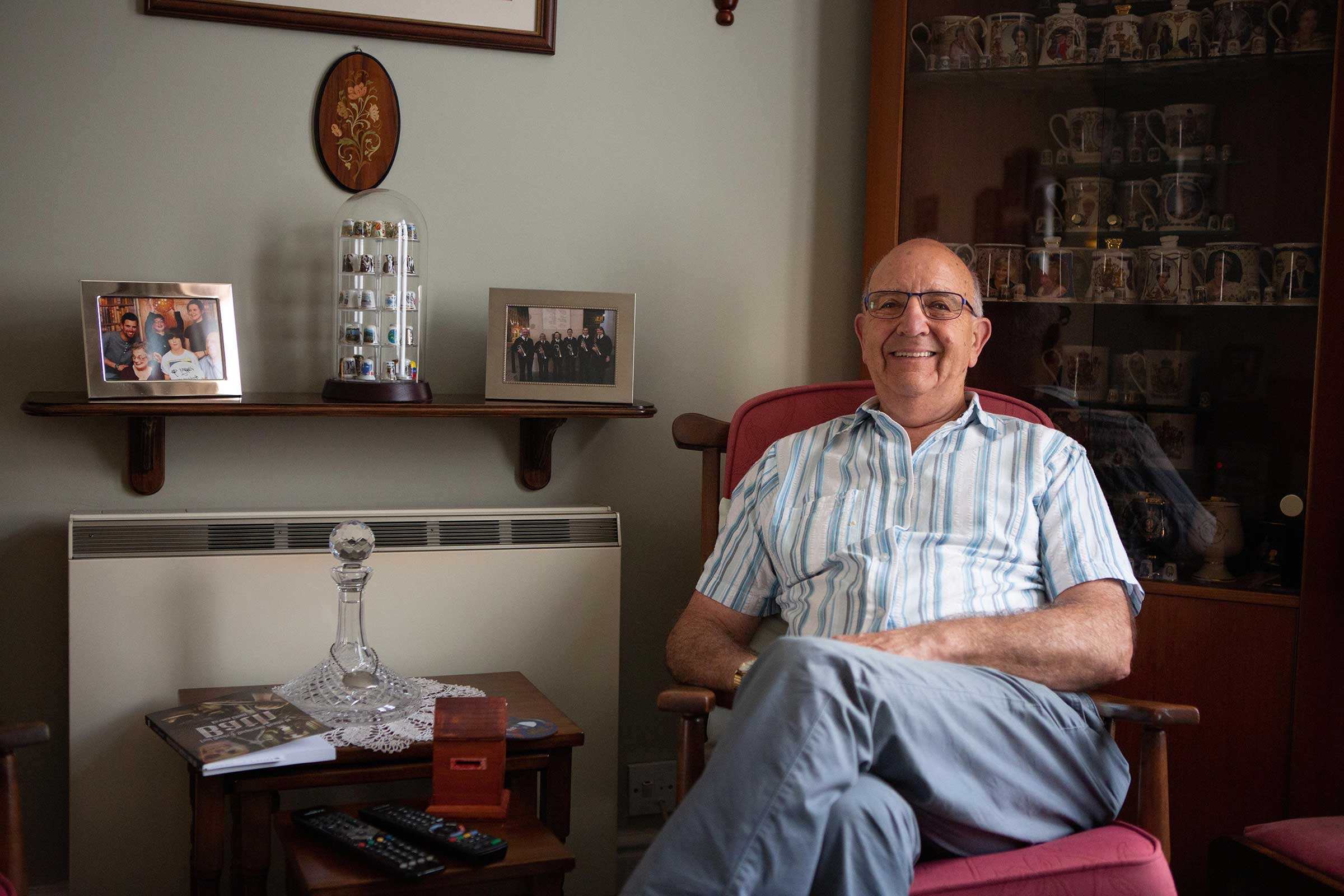 Man sat in his chair in his living room