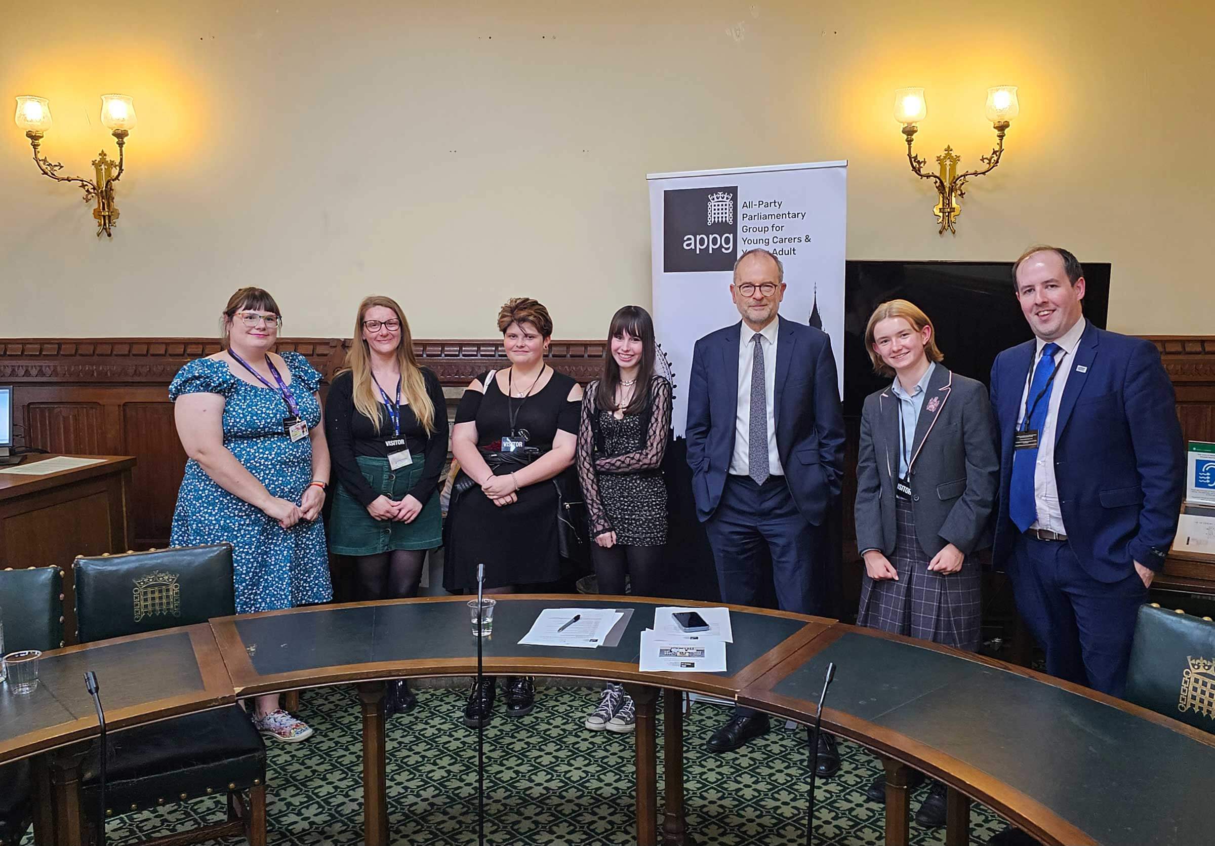Young carers at the House of Commons alongside MP Paul Blomfield and Andy McGowan, Carers Trust