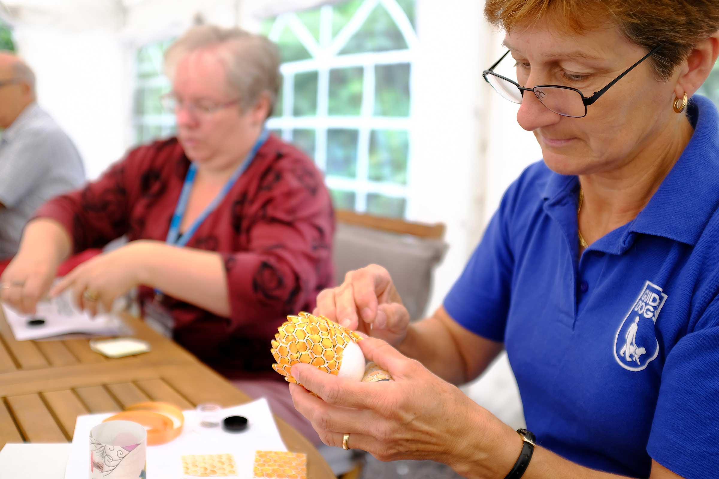 Close up of a lady doing crafts
