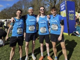 Group shot of Joe and his three housemates wearing Carers' Centre Bath Half T shirts