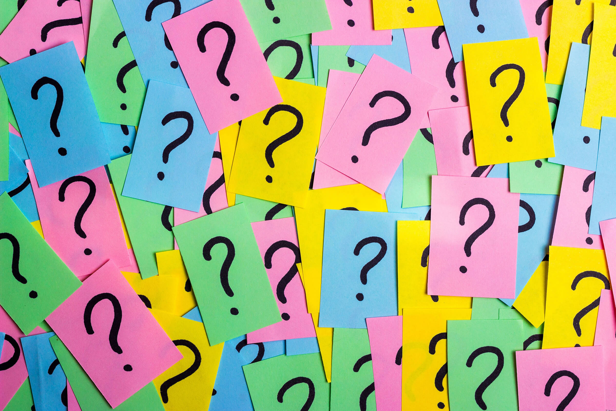 Different colour cards with question marks on them