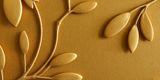 Golden coloured metal embossing of leaves