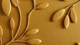 Golden coloured metal embossing of leaves